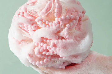 pink loofah used to clean the body 